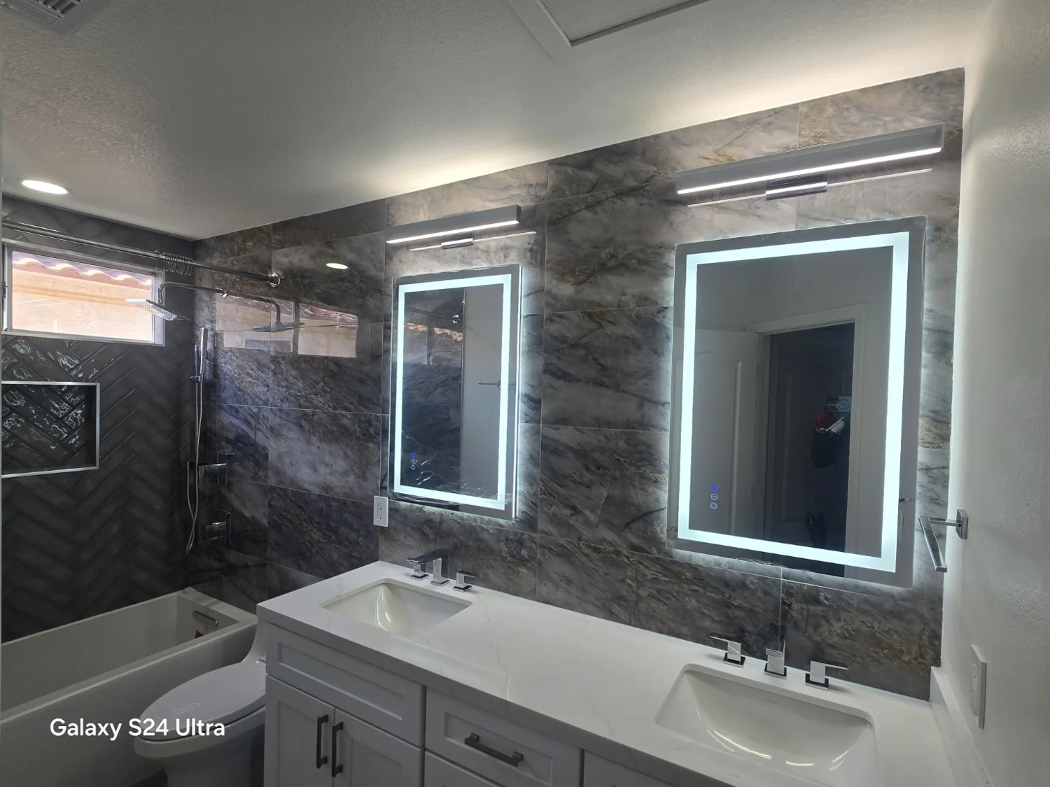 Illuminated bathroom mirrors